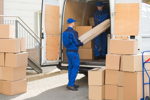 Removal team planning a move in a Watford residential street