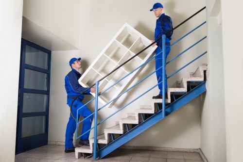 Careful piano moving through a narrow Watford staircase