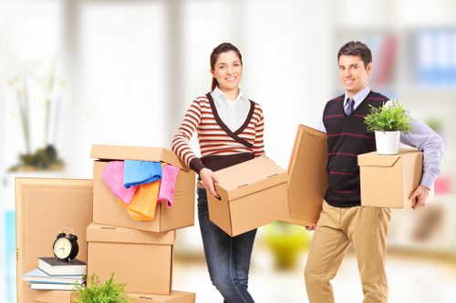 Removal team handling house move items in Watford