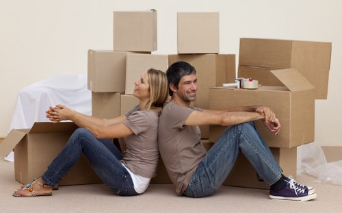 Furniture removal van with wrapped items for Watford relocation