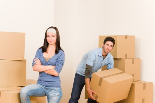 Unpacking furniture and boxes in a new Watford flat